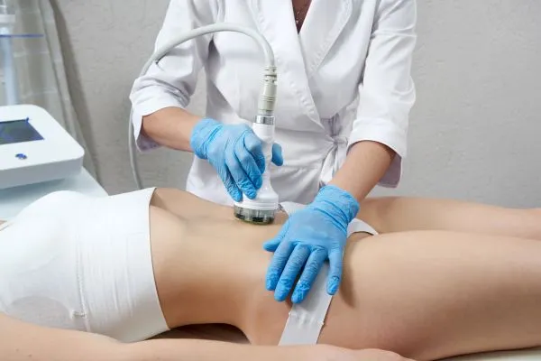 Lost the Weight but Not the Loose Skin? 2 woman having HIFU treatment on her stomach to combat loose skin Southsea following weight loss